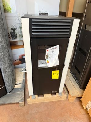 an image of a black and white refrigerator in a room