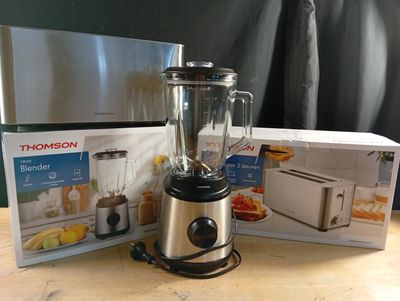 a blender that is sitting on a table next to a box