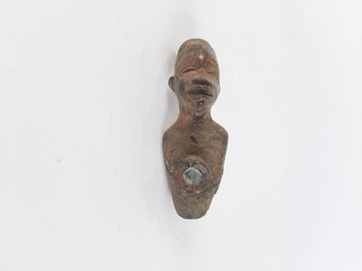 sculpture of a woman ' s head on a wall with a white background
