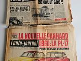 two old french newspapers with cars on them sitting on a table