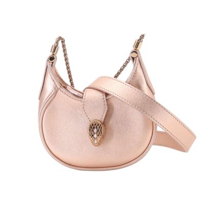 a close up of a pink purse with a chain around it