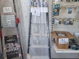a lot of shelves in a store that have various items on them