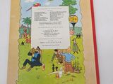an old children ' s book with a picture of a man and a woman in a park