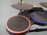 a close up of a drum set on a stand