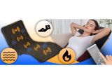 the woman is laying on the couch with her feet up and a remote control