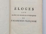 an open book with a black and white title on it