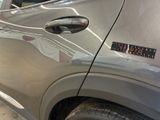 a car with a sticker on the side of it ' s door