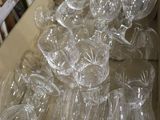 many empty wine glasses in a box on the table