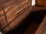 a wooden chest that has a wooden lid on it