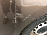 a close up of a car ' s paint job on the side of the car