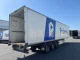 a white and blue box truck parked in a parking lot