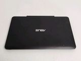the back of a laptop computer sitting on top of a white table