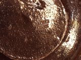 a brown pan with a brown substance on top of it