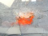 a red fire hydrant in the window of a car