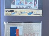 two framed pictures of a post office and a post box