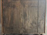 an image of a wooden cabinet with wheels on a white background