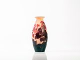 a vase that is sitting on a table with a white background