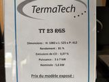 a sign that says termatech on it in front of a laptop