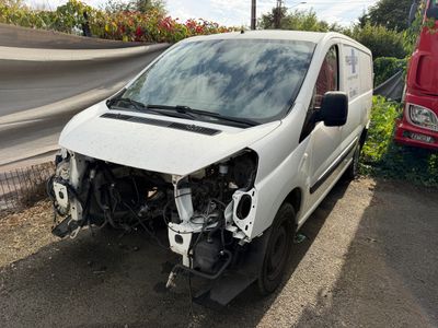 a white van that is sitting on the side of the road