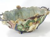 a large bowl with a design on it on a white surface