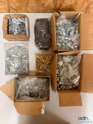 many different types of screws and nuts in a box