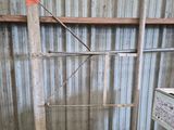 a pile of wood in a room with a metal roof