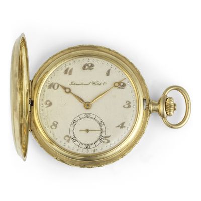 an old gold pocket watch with roman numerals and roman numerals on the face