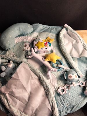 a baby ' s bed with a stuffed animal on top of it
