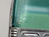 a close up view of a green and silver car