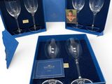 three empty wine glasses in a blue box with a picture of a woman in the background