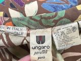 an image of a person holding a label on a dress