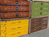 several boxes are stacked on top of each other on a sidewalk
