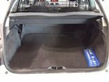 the back of a car with the trunk open and luggage in the trunk