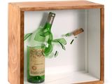a bottle of wine and a cigar in a wooden box