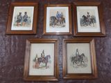 four framed pictures of men on horseback mounted on a wall
