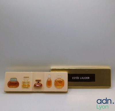 an image of a bottle of perfume sitting on top of a box