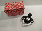 a red and white box and a black and white object on a table