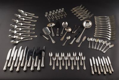 a lot of silver spoons and spoons on a table