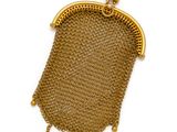a gold mesh purse with a chain handle