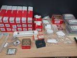 a table with a lot of electronics on top of it