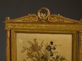 a picture of a gold frame with flowers on it