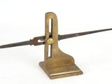 a small metal object with a long blade on it