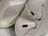 two airpods sitting next to each other on a table