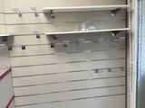 a picture of a store with shelves and shelves on the wall