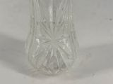 a glass salt and pepper shaker on a white table