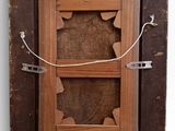 a picture of a wooden frame with a picture in it