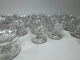 a lot of glasses that are sitting on a table