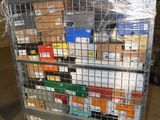 a metal cart with many boxes on it in a warehouse