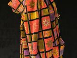 an image of a colorful coat on a mannequin
