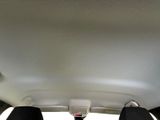 two seats in the back of a car with a remote control
